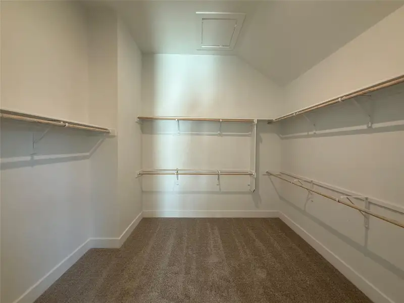 Walk-in closet in Primary Bedroom Walk-in closet in Primary Bedroom