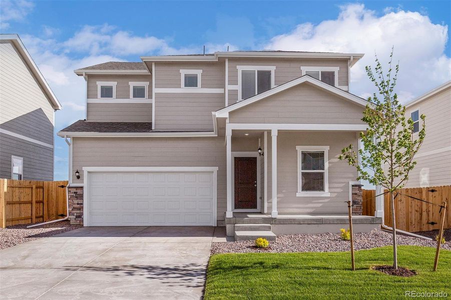 Front exterior of a new home in Bennett Ranch, Bennett, CO, highlighting curb appeal (Image 14).
