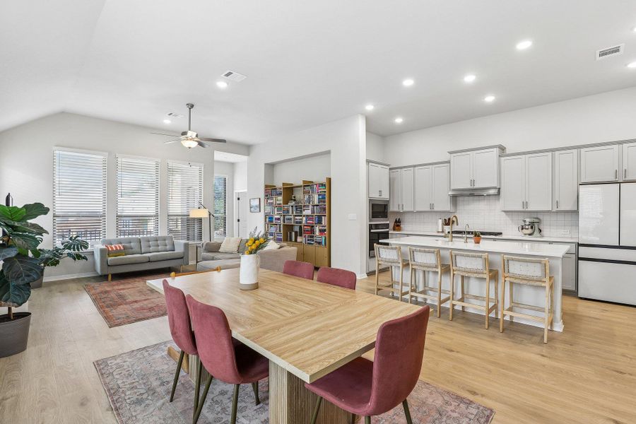An inviting open-concept living space integrates a well-appointed kitchen with abundant natural light.