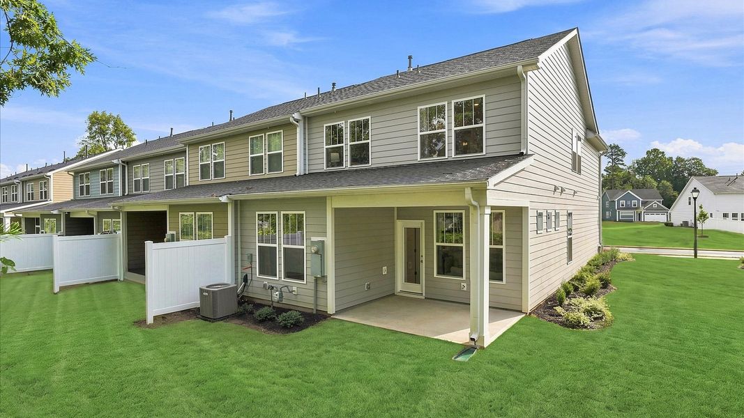Exceptional outdoor living begins with a covered back porch in this thoughtfully designed villa at Pelham Crossing