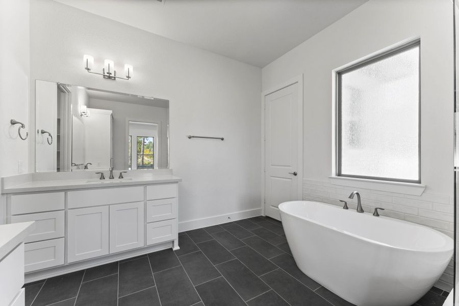 Large free-standing tub and privacy window. Large free-standing tub and privacy window.