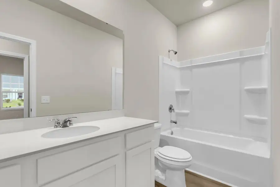 Full hall bathroom with modern finishes and sleek fixtures.