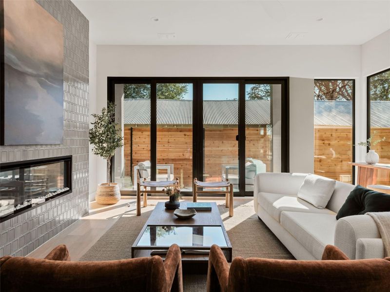 Living room featuring a tile fireplace