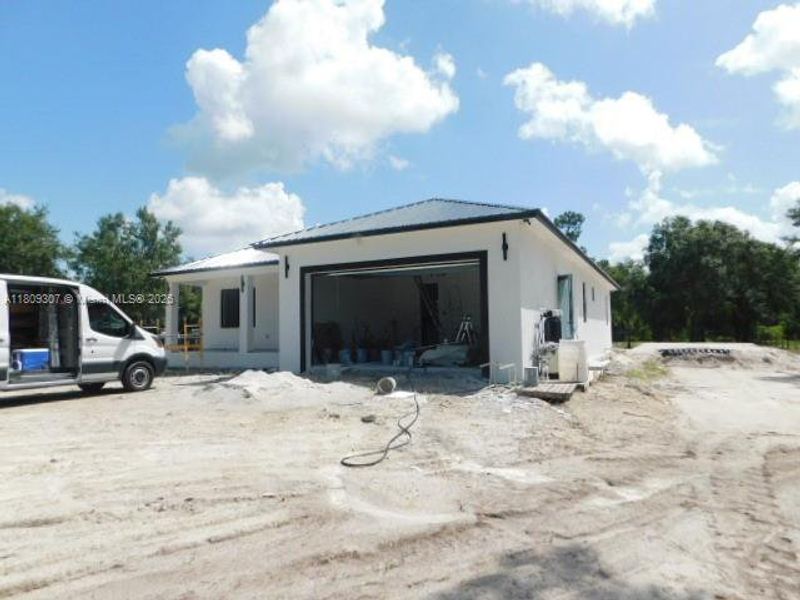 Front exterior of a new home in , Clewiston, FL, highlighting curb appeal (Image 1). Front exterior of a new home in , Clewiston, FL, highlighting curb appeal (Image 1).