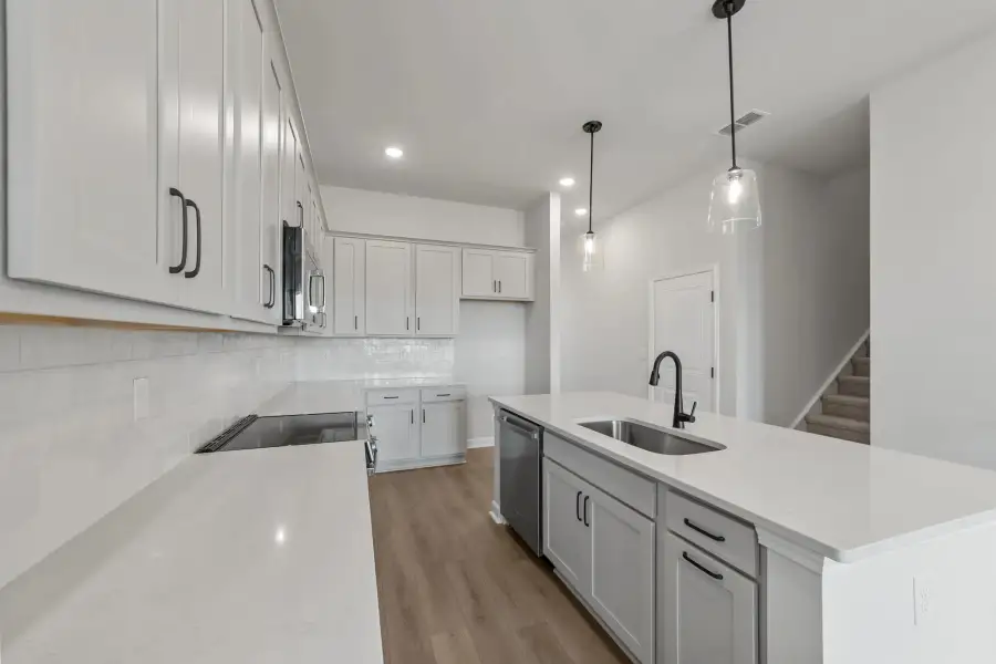 Sample Kitchen photo. Actual structural options and design finishes of home may vary.