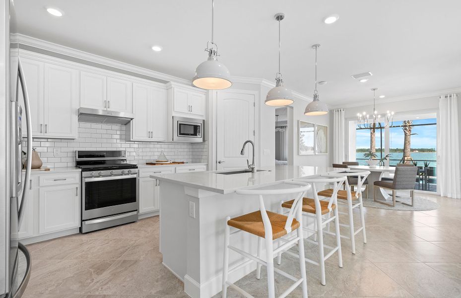 Gourmet kitchen with center island and stainless steel appliances