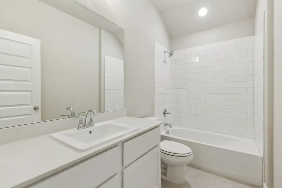 Bathroom in the Heisman home plan by Trophy Signature Homes – REPRESENTATIVE PHOTO