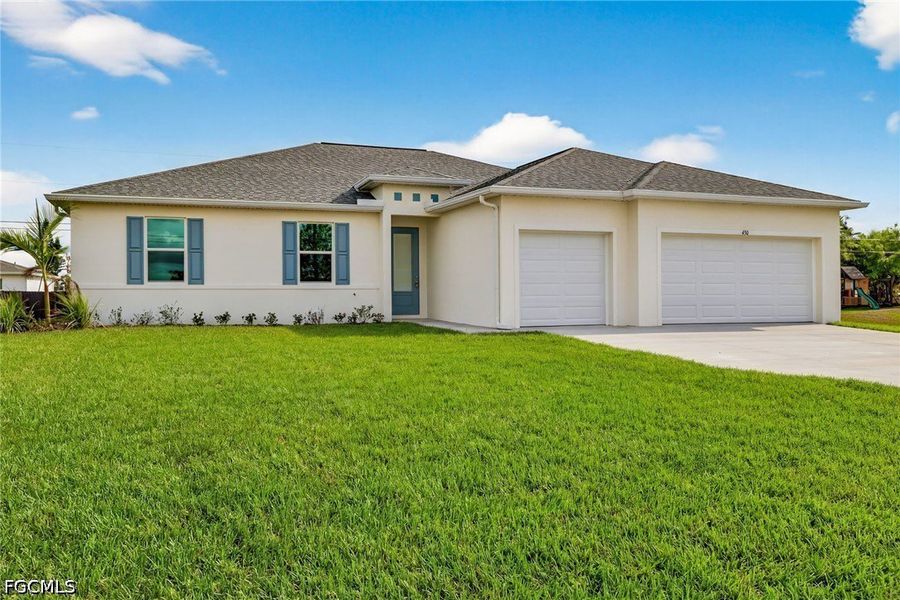 Front exterior of a new home in Cape Coral, Cape Coral, FL, highlighting curb appeal (Image 1). Front exterior of a new home in Cape Coral, Cape Coral, FL, highlighting curb appeal (Image 1).