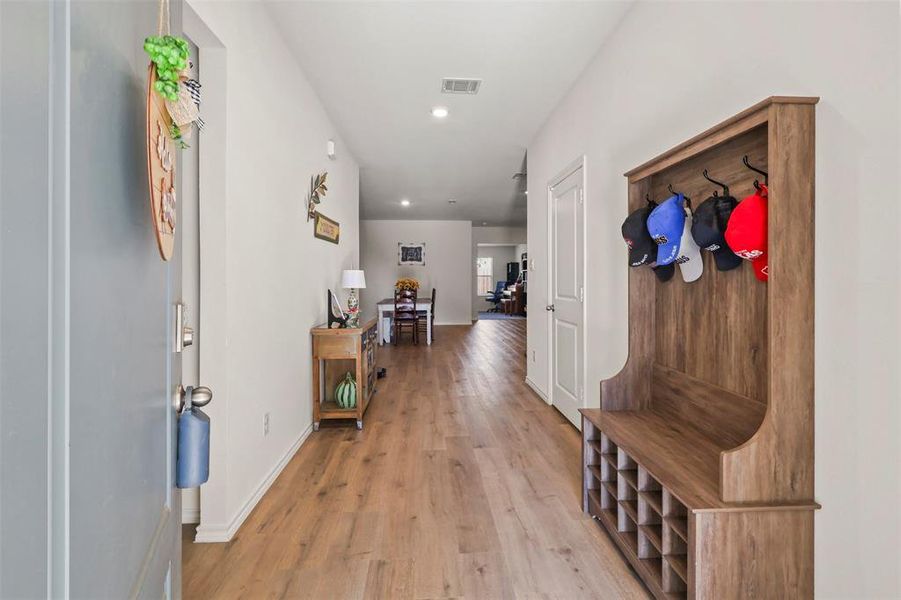 Hall featuring light wood-style floors and recessed lighting