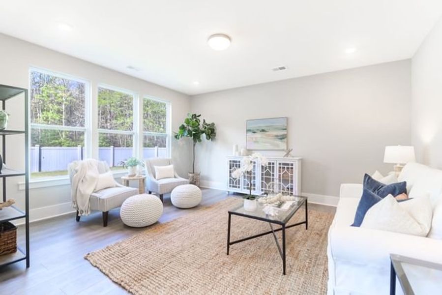 Representative furnished interior of a home built from the Inverness P by True Homes in Homecoming, Ravenel (Image 9).