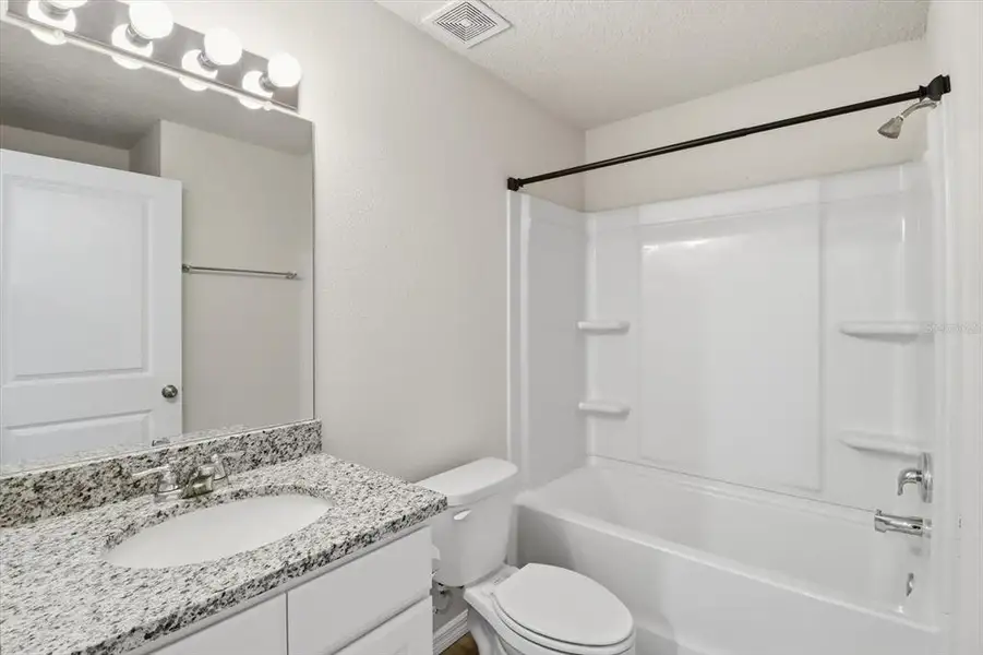 Furnished interior view inside a new home in , Dunnellon (Image 7).