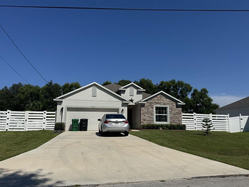 Front exterior of a new home in , Port St. Lucie, FL, highlighting curb appeal (Image 24).