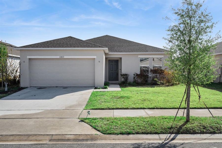 Front exterior of a new home in Liberty Preserve, Leesburg, FL, highlighting curb appeal (Image 2). Front exterior of a new home in Liberty Preserve, Leesburg, FL, highlighting curb appeal (Image 2).
