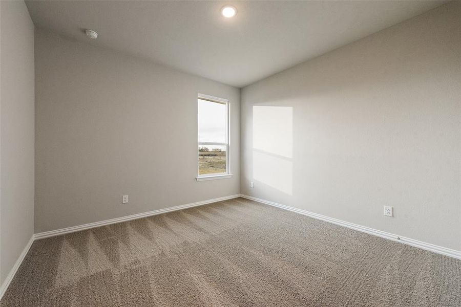 Unfurnished room with carpet floors, vaulted ceiling, and recessed lighting