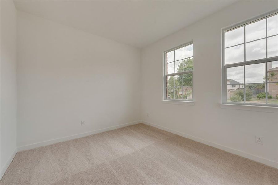 View of carpeted spare room