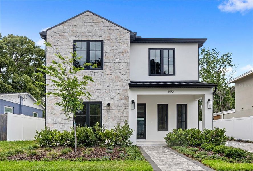 Front exterior of a new home in , Orlando, FL, highlighting curb appeal (Image 30). Front exterior of a new home in , Orlando, FL, highlighting curb appeal (Image 30).