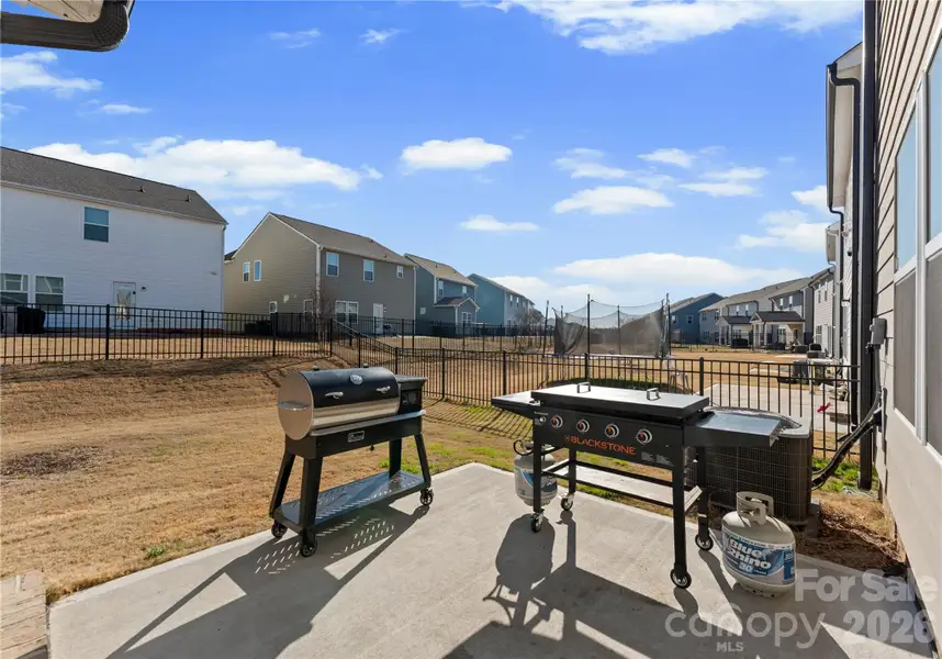 Exterior details and patio area of a home in Scotch Meadows, Monroe (Image 3).