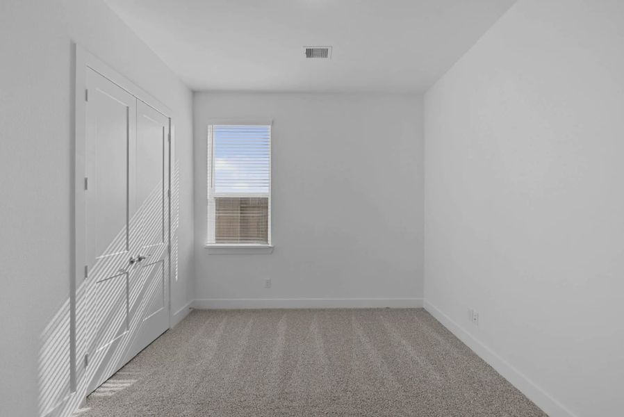 Representative unfurnished interior of a home built from the Nicklaus by Chesmar Homes in Riceland Alley Loads, Mont Belvieu (Image 73).