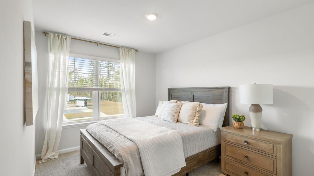 Furnished interior view inside a new home in Pine Hills Townhomes at Cane Bay, Summerville (Image 14).