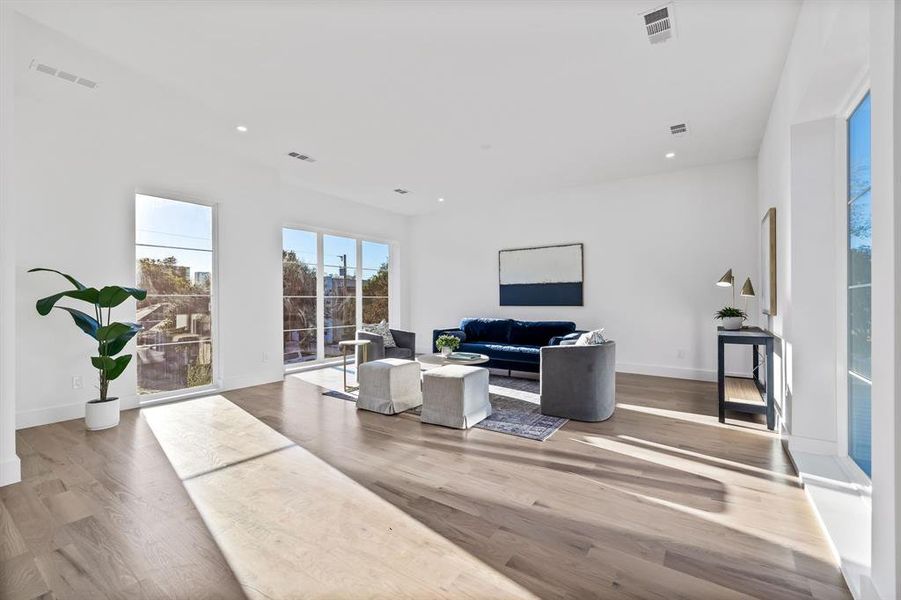 Living room with light hardwood / wood-style flooring