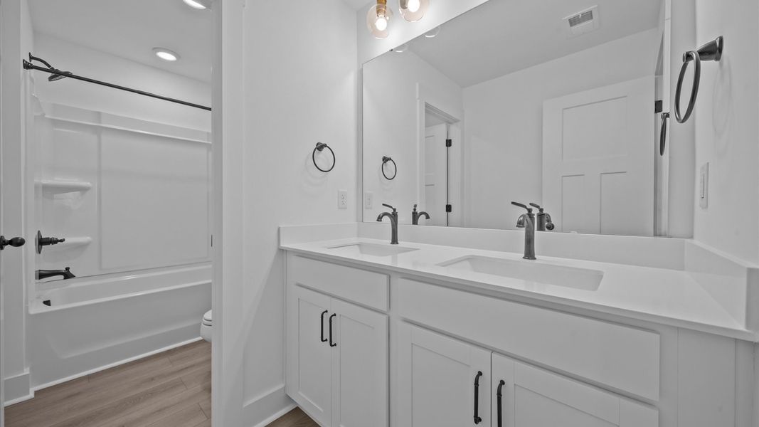 Top-notch bathroom with current fixtures, tasteful materials, and elevated charm Top-notch bathroom with current fixtures, tasteful materials, and elevated charm