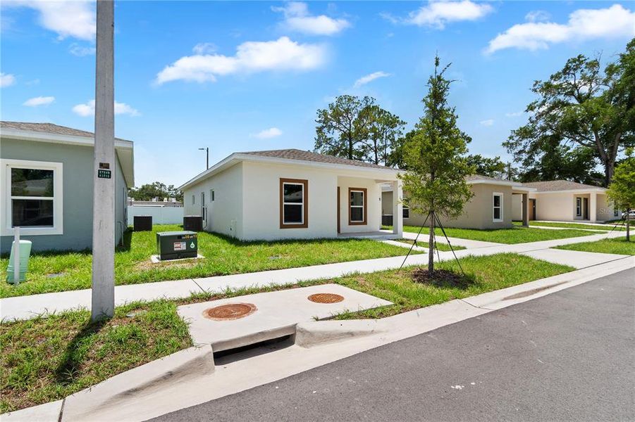 Front exterior of a new home in , Tampa, FL, highlighting curb appeal (Image 24). Front exterior of a new home in , Tampa, FL, highlighting curb appeal (Image 24).