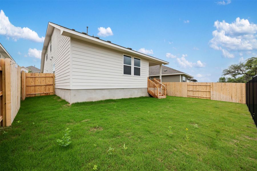 Exterior details and patio area of a home in Cannon Ranch, Dripping Springs (Image 22).