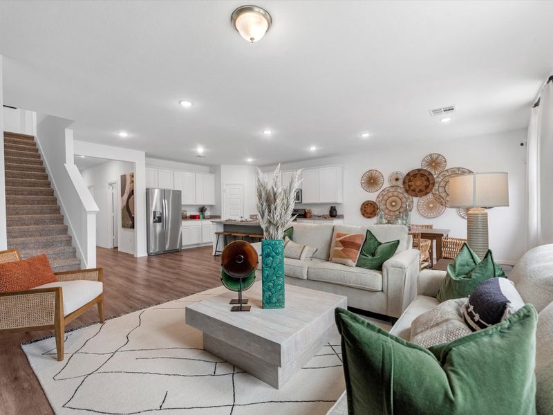A living room with a staircase.