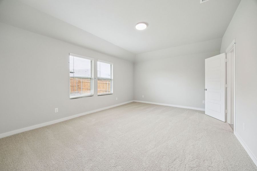 Primary Suite in the Hayden home plan by Trophy Signature Homes – REPRESENTATIVE PHOTO