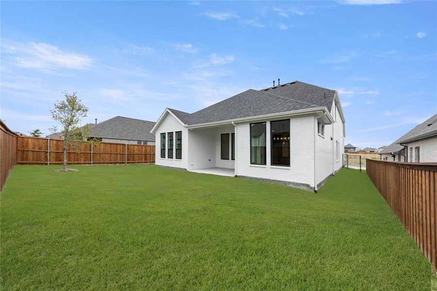 Front exterior of a new home in Hillstead, Lavon, TX, highlighting curb appeal (Image 26). Front exterior of a new home in Hillstead, Lavon, TX, highlighting curb appeal (Image 26).