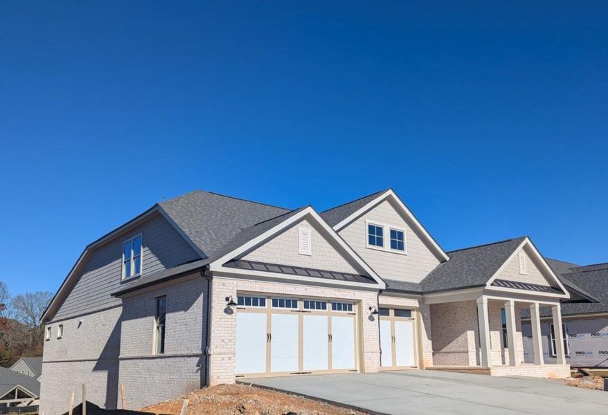 Front exterior of a new home in , Cumming, GA, highlighting curb appeal (Image 1). Front exterior of a new home in , Cumming, GA, highlighting curb appeal (Image 1).