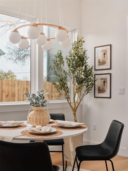 Dining area with light wood finished floors