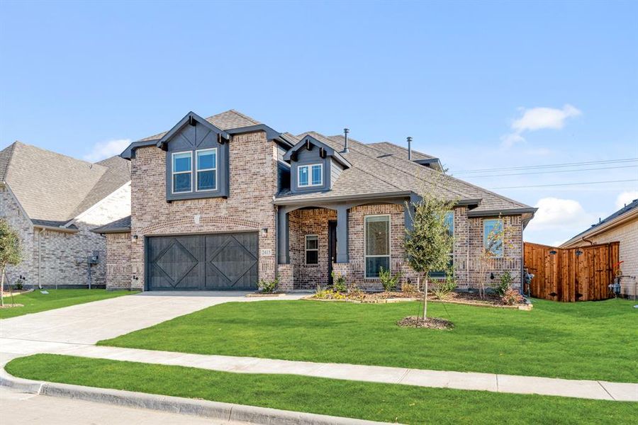 Front exterior of a new home in Sonoma Verde, McLendon-Chisholm, TX, highlighting curb appeal (Image 2).