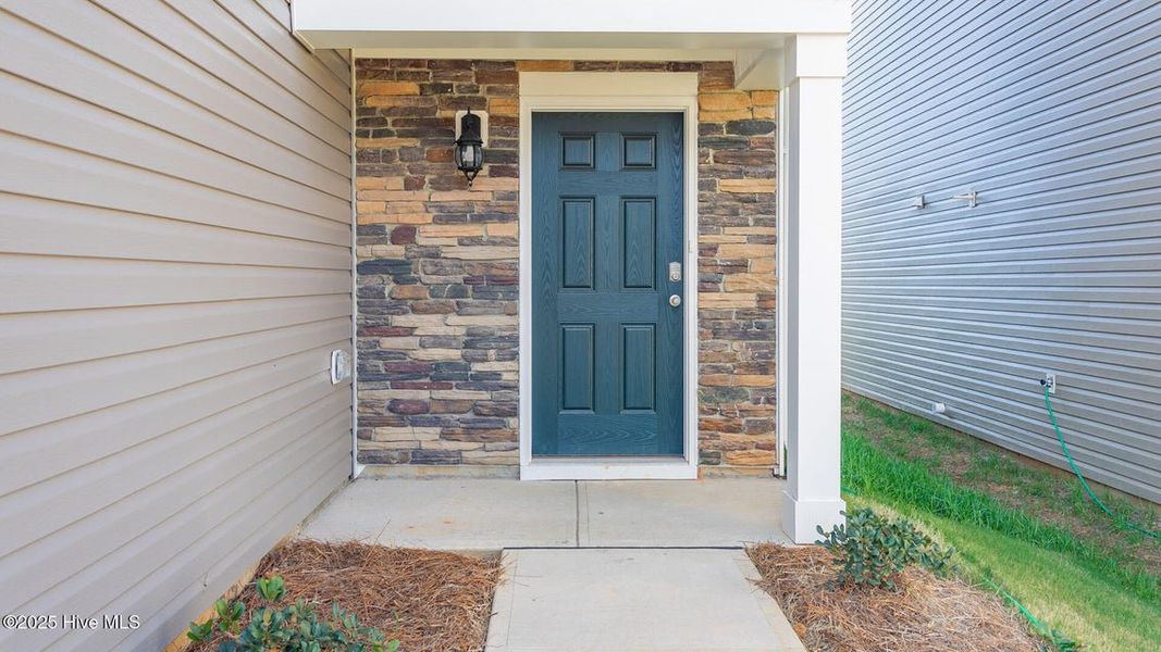 Front exterior of a new home in Hunter Hill, Rocky Mount, NC, highlighting curb appeal (Image 18). Front exterior of a new home in Hunter Hill, Rocky Mount, NC, highlighting curb appeal (Image 18).