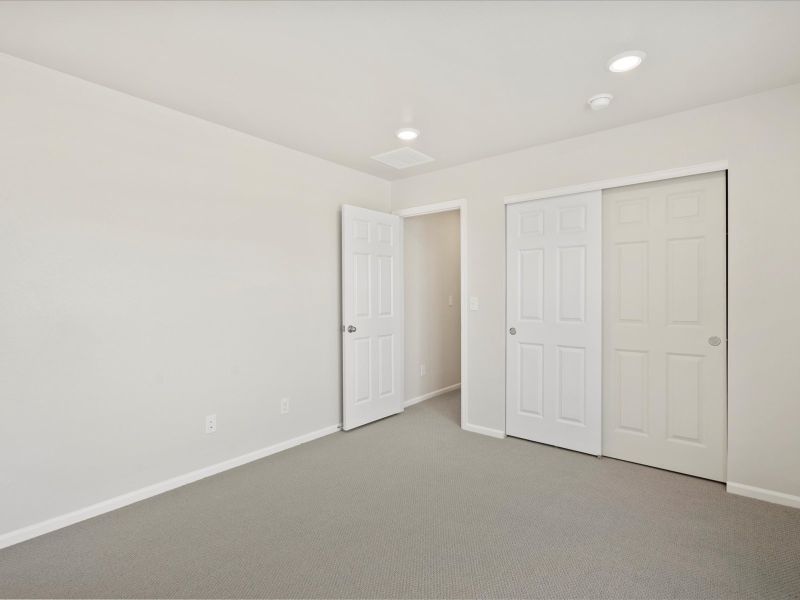 Spacious, unfurnished interior of a new home in Buffalo Highlands: The Flora Collection, Commerce City (Image 16).