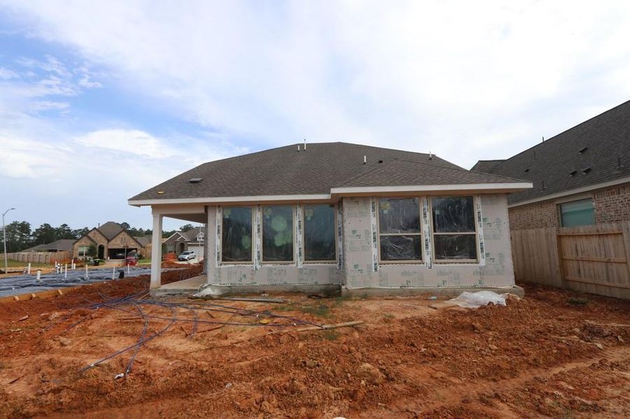 Front exterior of a new home in Escondido 45’ Homesites, Magnolia, TX, highlighting curb appeal (Image 2).