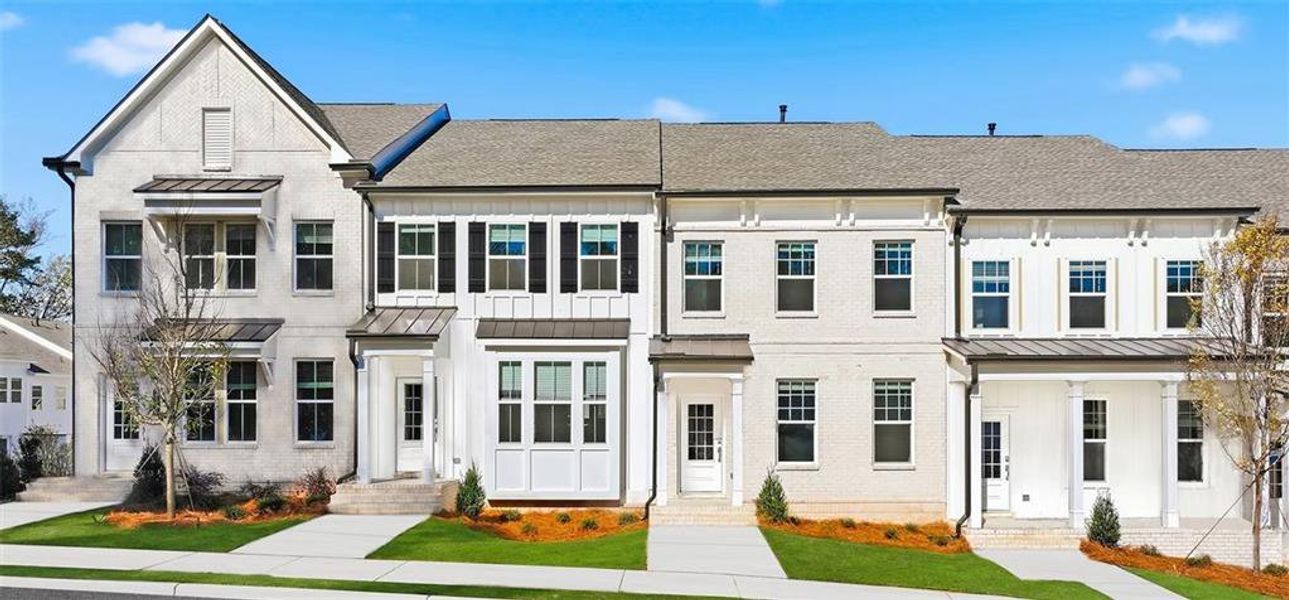 Front exterior of a new home in Towns at Creekside, Doraville, GA, highlighting curb appeal (Image 1). Front exterior of a new home in Towns at Creekside, Doraville, GA, highlighting curb appeal (Image 1).