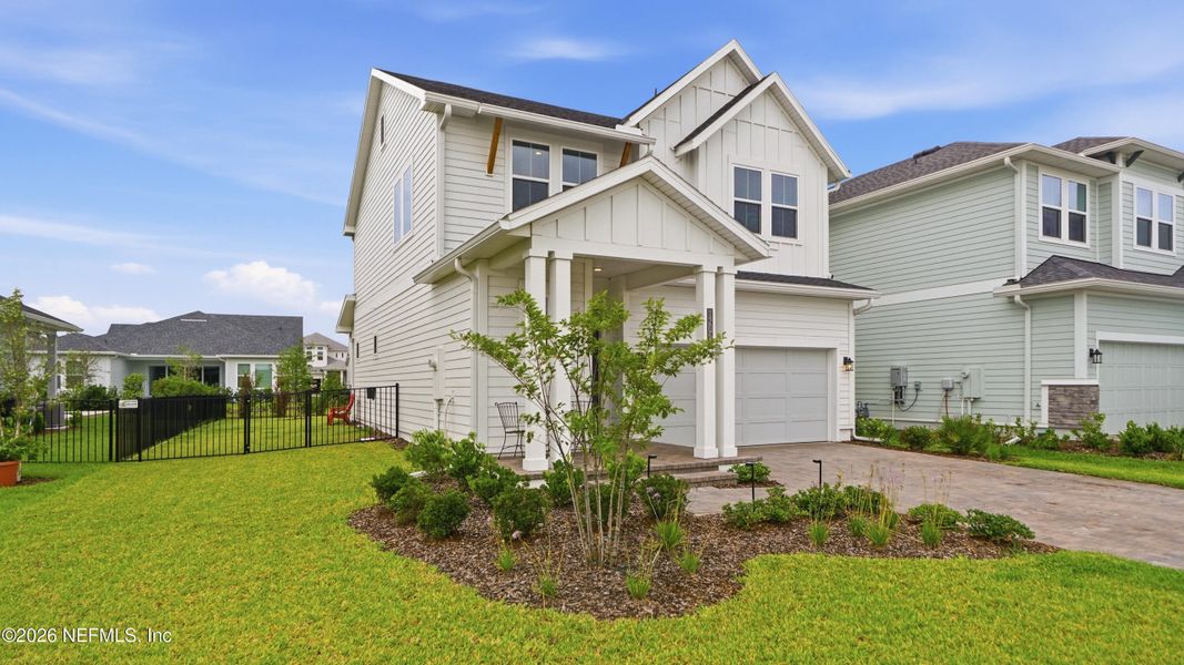 Front exterior of a new home in Seven Pines 40' Front Entry, Jacksonville, FL, highlighting curb appeal (Image 25).