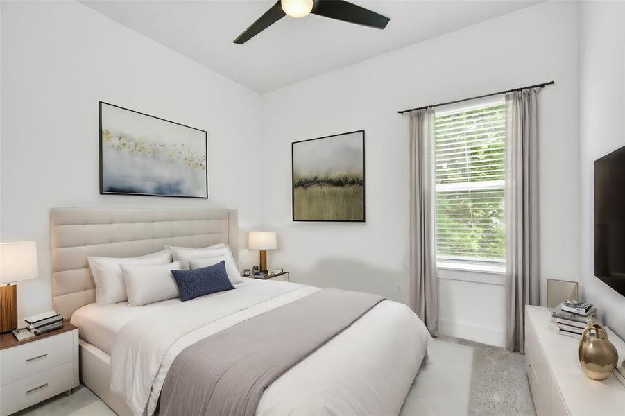 Retreat to the tranquility of 1 of 2 spacious guest bedrooms, featuring elegant ceiling fan, walk in closet, plush carpet and ample natural light for a serene and inviting ambiance