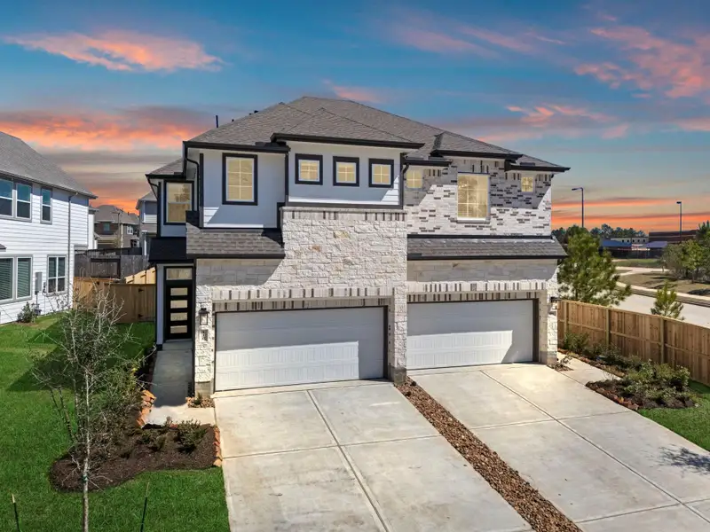 Front exterior of a new home in Woodforest, Montgomery, TX, highlighting curb appeal (Image 19).