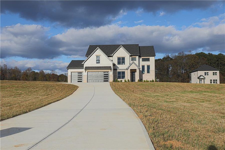 Front exterior of a new home in , Maysville, GA, highlighting curb appeal (Image 1).