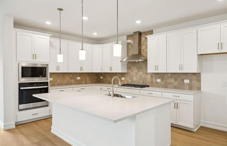 Kitchen featuring a large island ideal for informal dining and gatherings *Real home pictured Kitchen featuring a large island ideal for informal dining and gatherings *Real home pictured