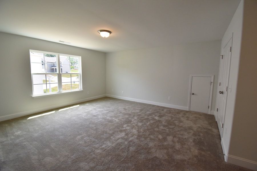 Representative unfurnished interior of a home built from the Ellerbe by Keystone Homes NC in Sullivans Reserve, Walkertown (Image 36).