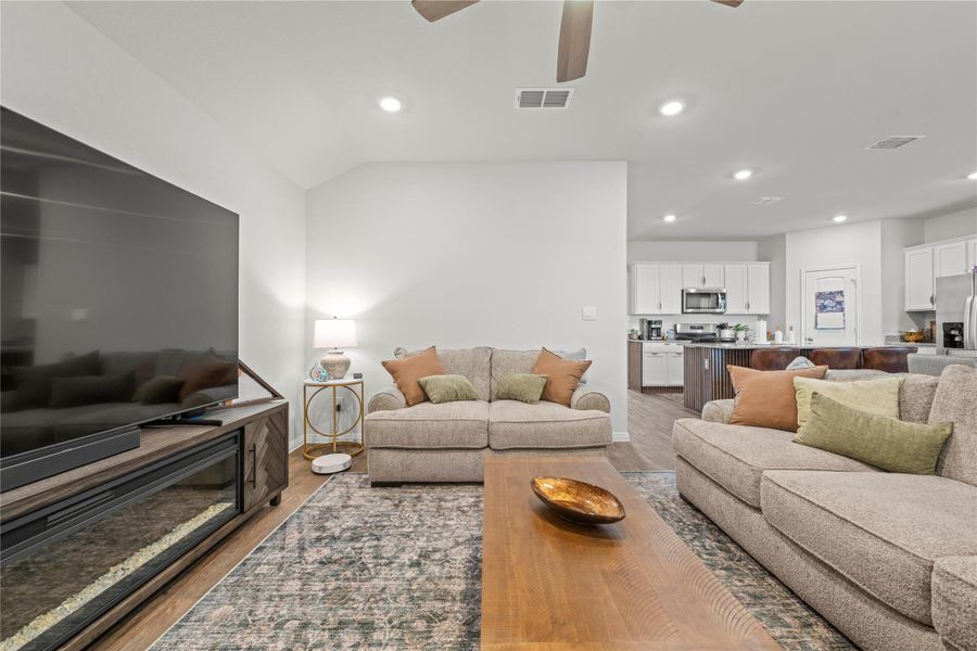 An inviting open-concept living area flows seamlessly into a well-appointed kitchen.
