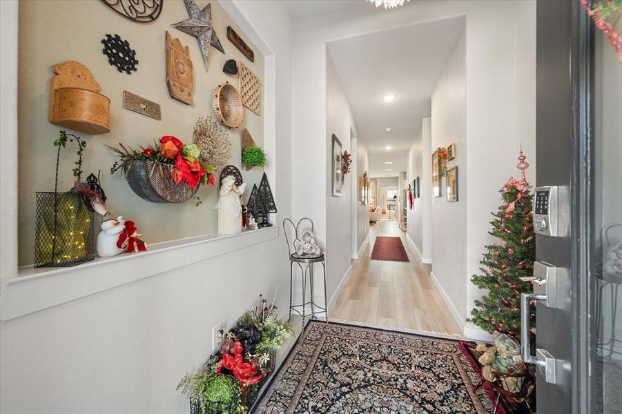 Hallway featuring wood finished floors and recessed lighting Hallway featuring wood finished floors and recessed lighting