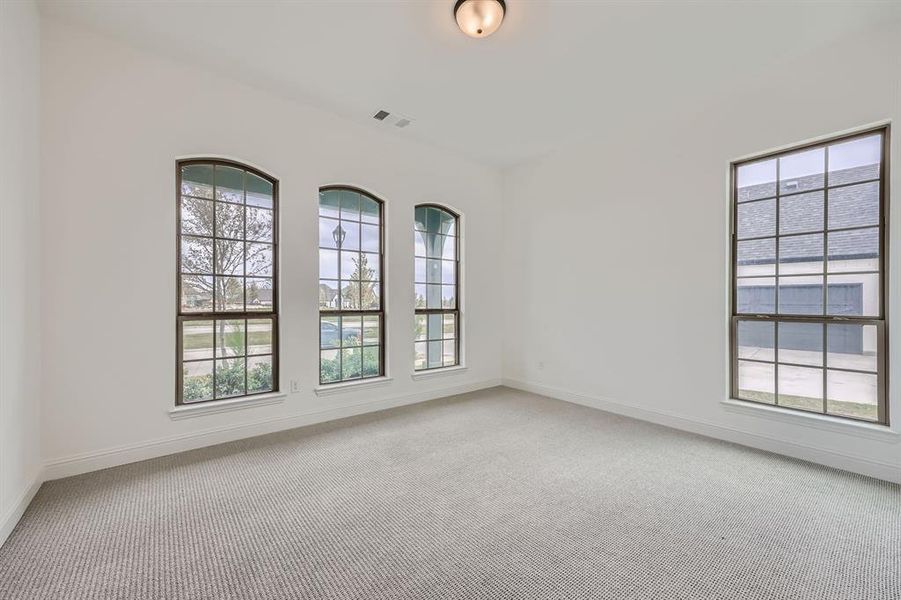 Spare room featuring carpet flooring