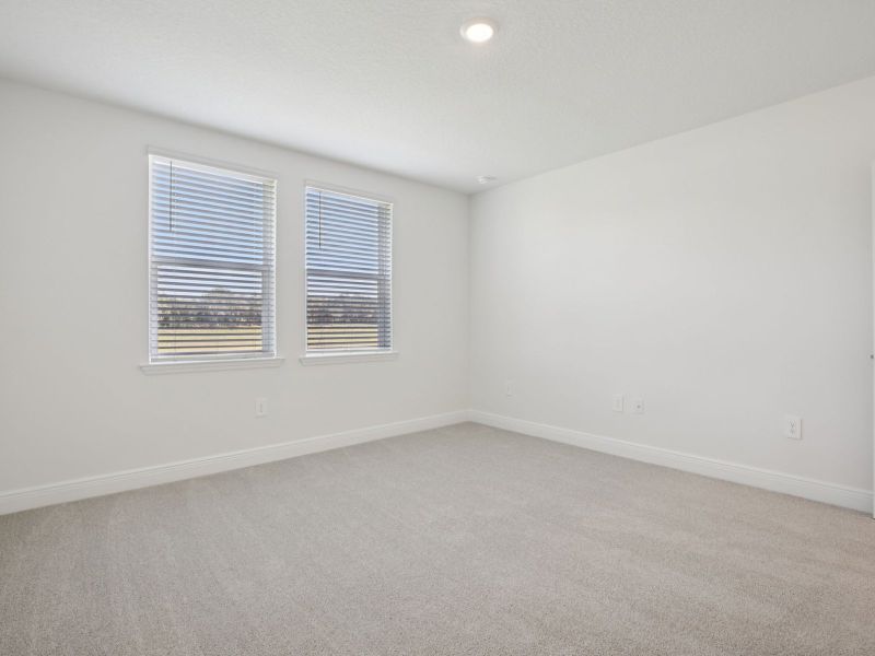 Spacious, unfurnished interior of a new home in The Reserve at Hammock Oaks - Classic Series, Lady Lake (Image 12).