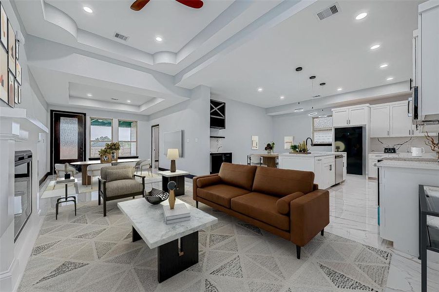 Appreciate the expansive dining and living area combination, featuring impressive high ceilings, with an inviting electric fireplace complemented by beautiful tile flooring.