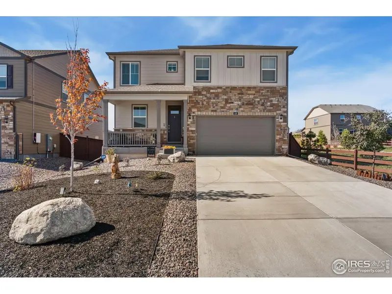 Front exterior of a new home in Mallard Ridge, Johnstown, CO, highlighting curb appeal (Image 2).