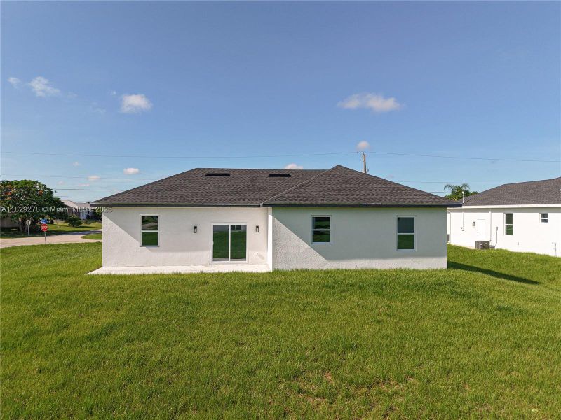 Front exterior of a new home in , Lehigh Acres, FL, highlighting curb appeal (Image 30).